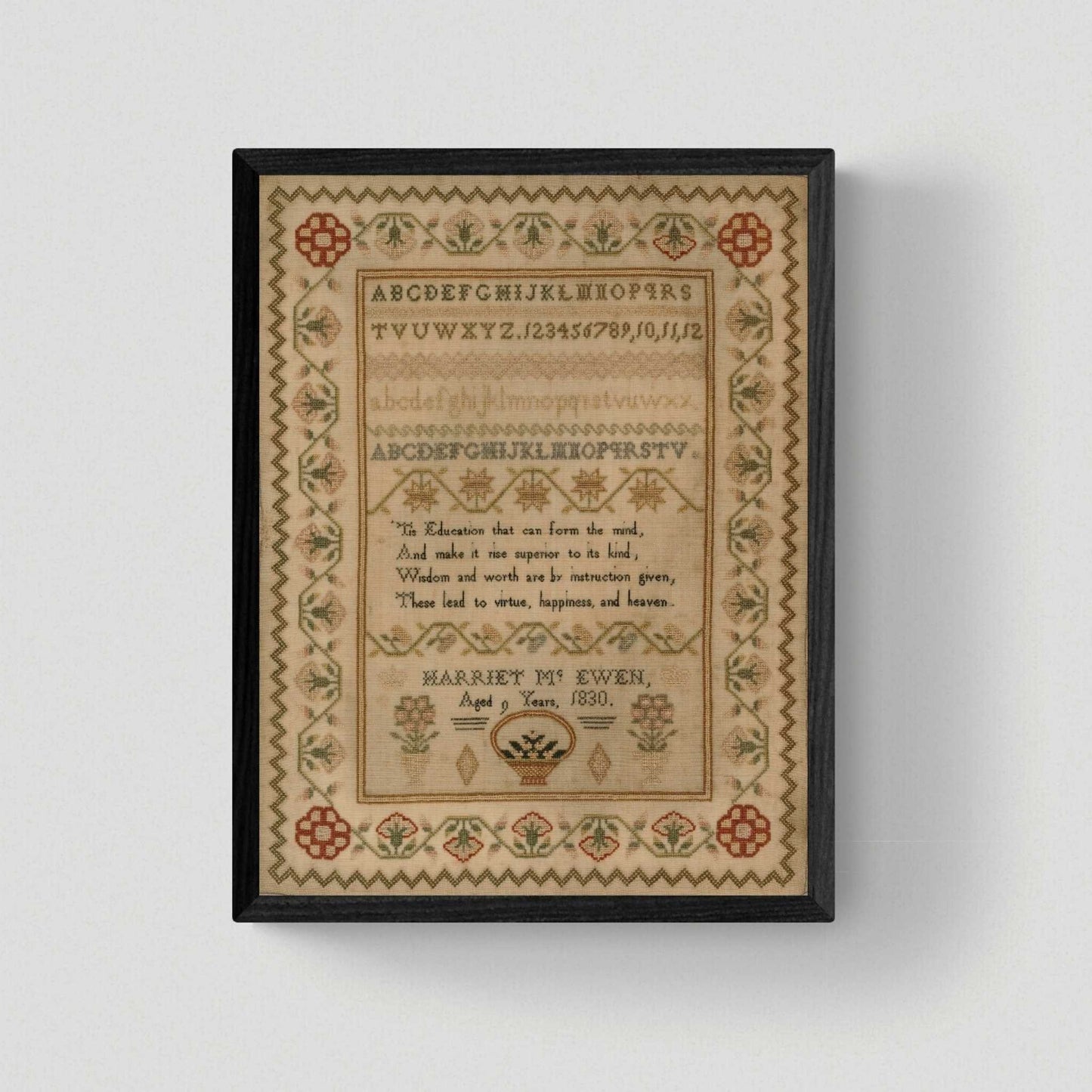 a framed version of Harriet Mc Ewen Sampler stitched in 1830