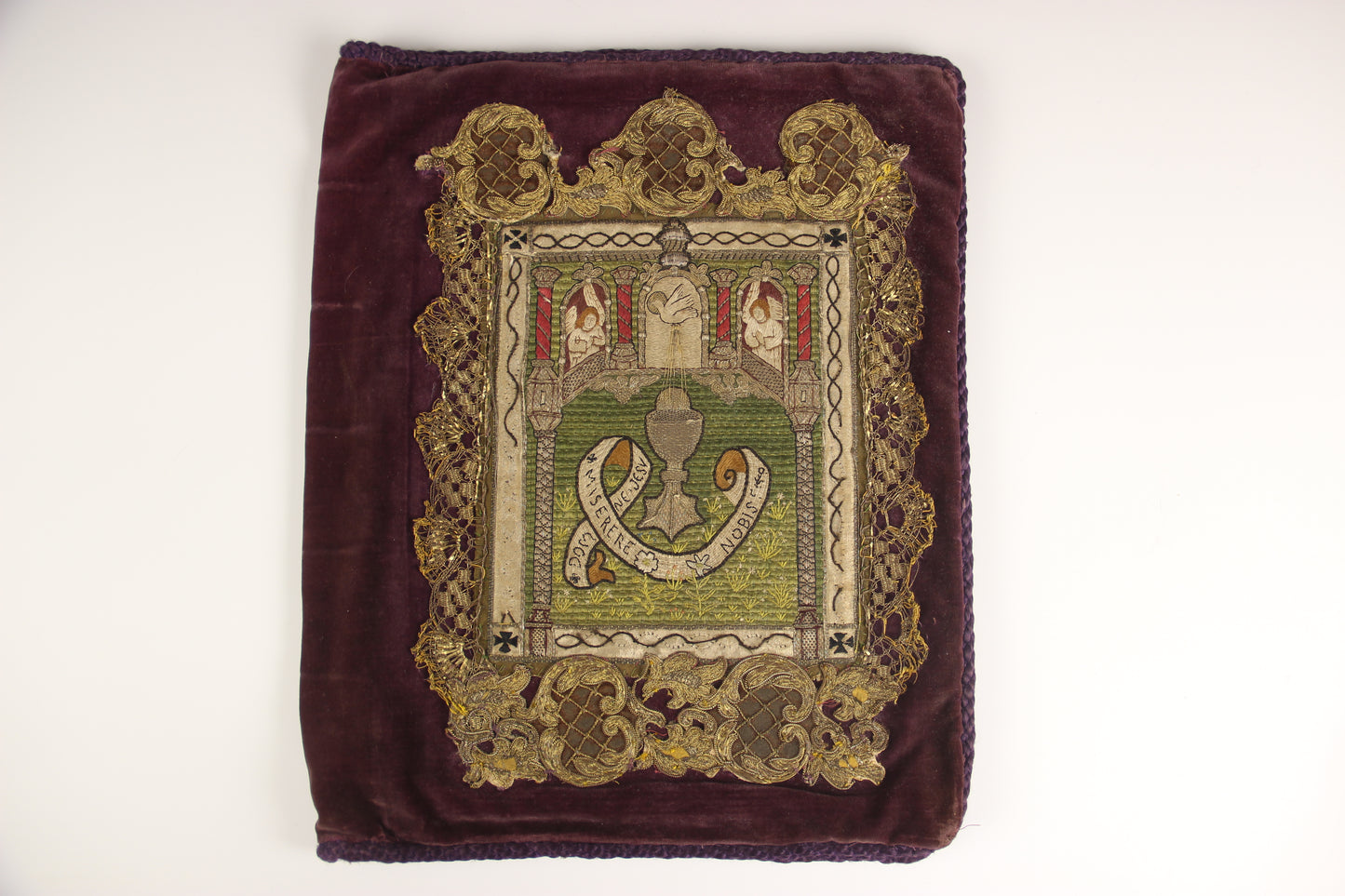 An 18th century embroidered applique Bible Cover depicting the sacrament